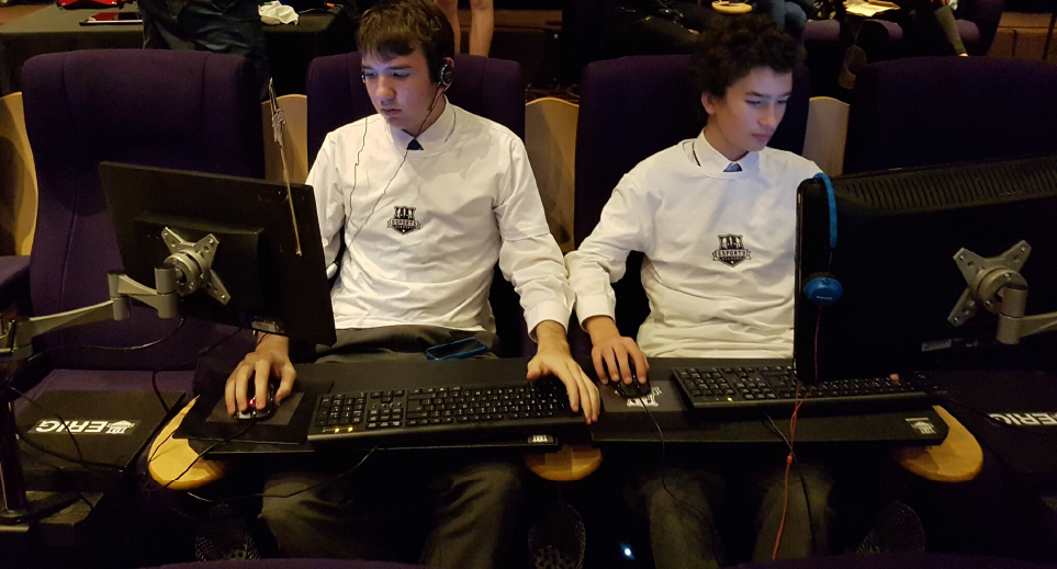Students competing on Esports Academy e-Rig equipment at a live venue